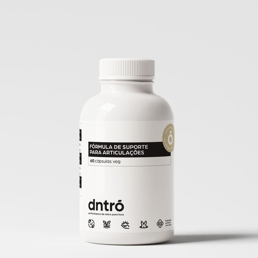 Frasco do suplemento Dntró Fórmula de Suporte para Articulações com 60 cápsulas veganas. Produto desenvolvido para saúde articular, com embalagem branca minimalista, selo de pureza e ícones de produto vegano, sem glúten, sem lactose e não testado em animais.