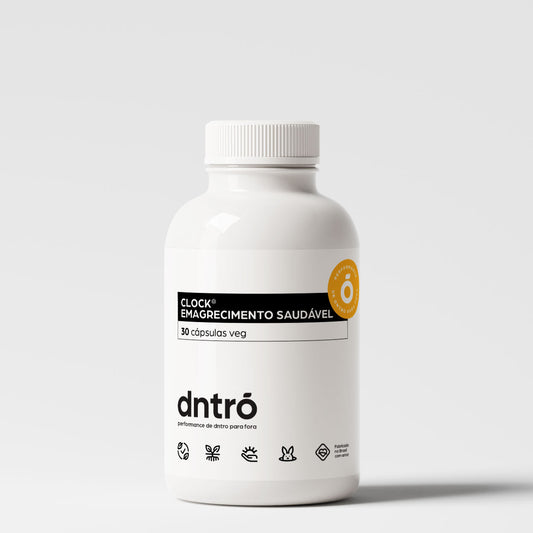 Frasco do suplemento DNTRO Clock® Emagrecimento Saudável com 30 cápsulas veganas. Embalagem branca, rótulo preto e selo laranja. Fórmula natural para controle de peso com performance de dentro para fora. Produto vegano, sem testes em animais.